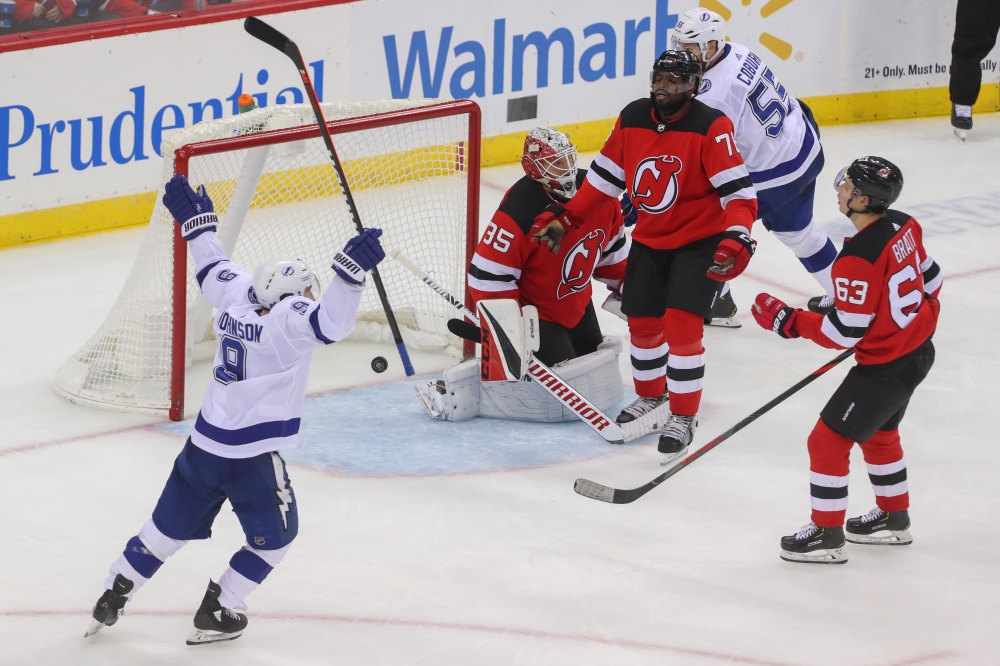 Tampa Bay Lightning left wing Ondrej Palat (18), not shown, scores a goal on New Jersey Devils goaltender Cory Schneider (35) during the third period at Prudential Center in Newark, New Jersey, on Wednesday. — Reuters