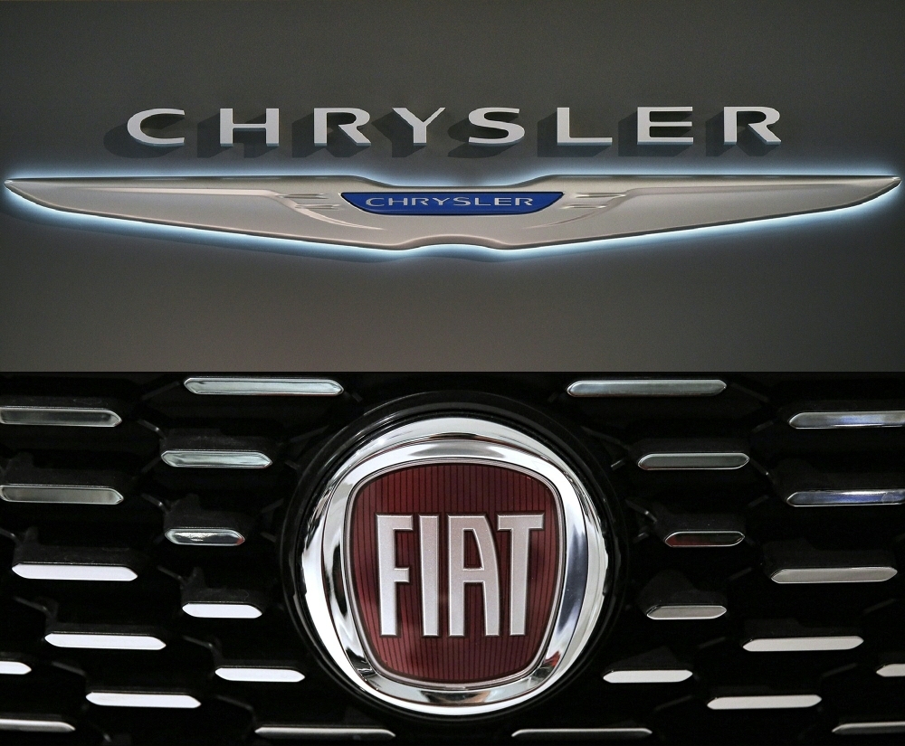 This combination of file pictures created on Thursday shows a Chrysler logo seen at the 2016 Washington Auto Show on Jan. 27, 2015 in Washington and a picture of the logo of Italian auto maker Fiat on Jan. 12, 2017 in Saluzzo, near Turin. — AFP