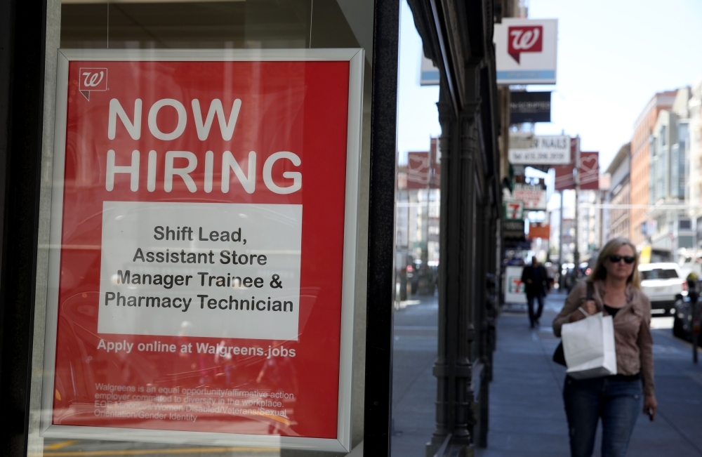 A now hiring sign is posted in the window of a Walgreens store in San Francisco, California, in this June 6, 2019 file photo. — AFP