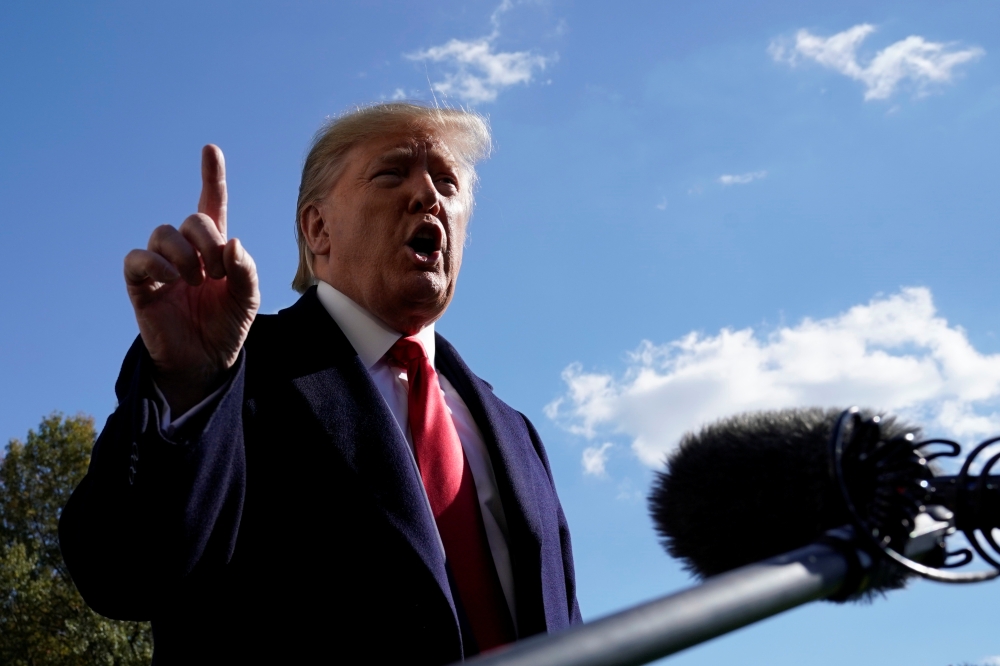 U.S. President Donald Trump speaks to the media on the South Lawn of the White House in Washington upon his return from New York, on Sunday. -Reuters