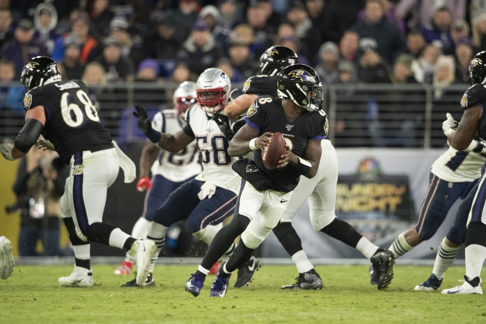 Baltimore Ravens quarterback Lamar Jackson (8) rolls out to pass during the fourth quarter against the New England Patriots at M&T Bank Stadium, Baltimore, MD, USA, on Sunday. — Reuters