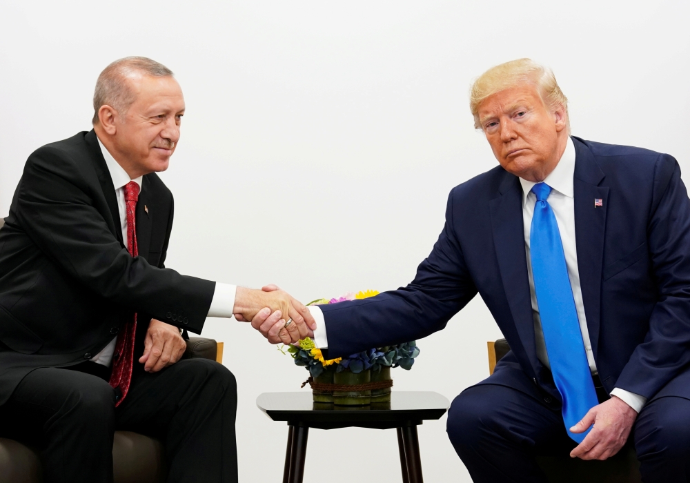 US President Donald Trump shakes hands during a bilateral meeting with Turkey's President Tayyip Erdogan during the G20 leaders summit in Osaka, Japan, in this June 29, 2019 file photo. — Reuters