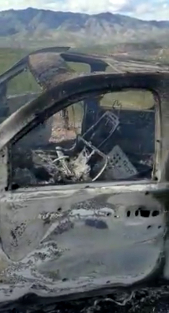 The burned wreckage of a vehicle transporting a Mormon family living near the border with the US is seen, after the family was caught in a crossfire between unknown gunmen from rival cartels, in Bavispe, Sonora, Mexico, on Monday, in this picture obtained from social media. — Reuters