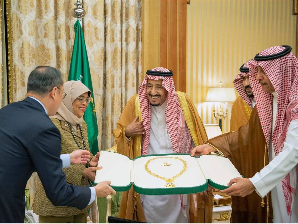 Custodian of the Two Holy Mosques King Salman presents the King Abdulaziz Necklace to President Halimah Yacob of Singapore in Riyadh on Wednesday. — SPA