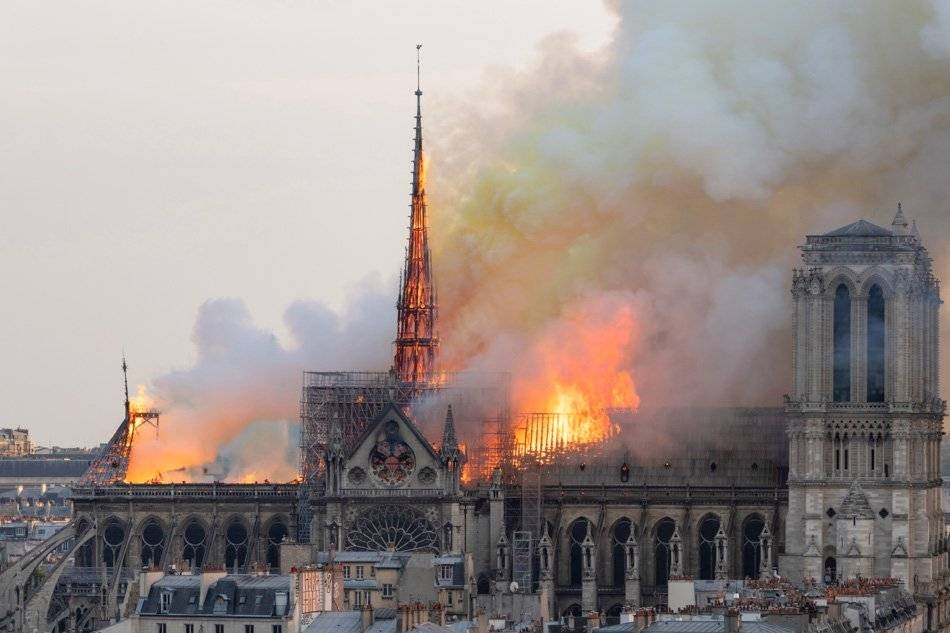 Smoke billows as flames burn through the roof of the Notre-Dame de Paris Cathedral in the French capital Paris in this file photo. — AFP