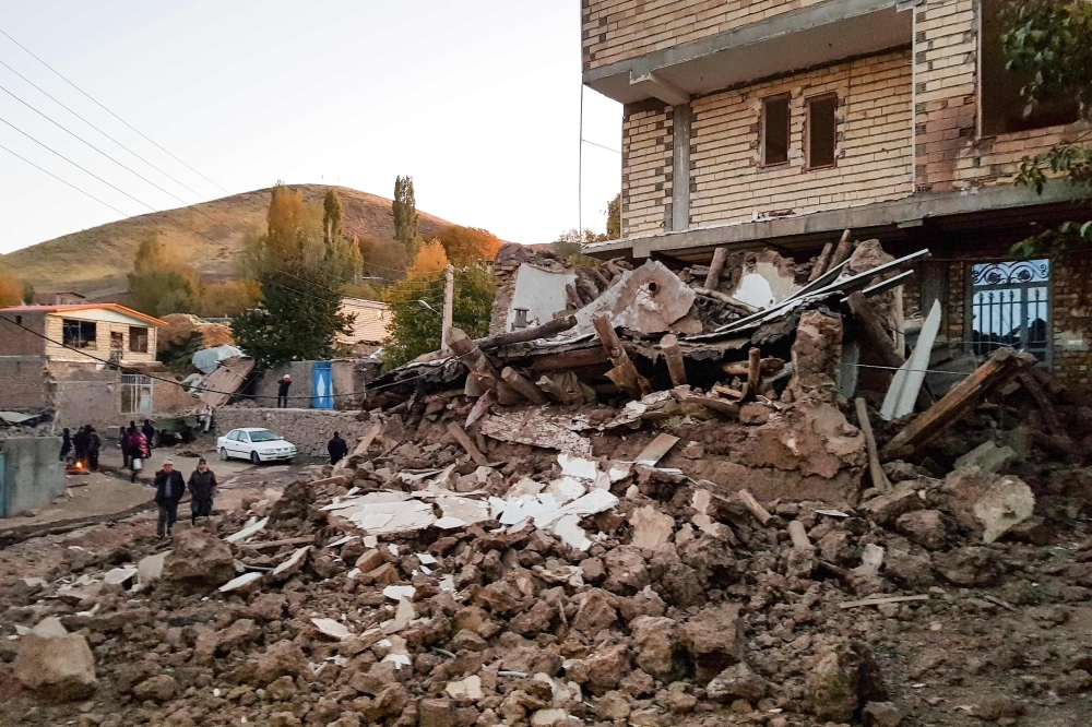The debris of buildings in the Iranian village of Varnakesh, about 120 km (75 miles) southeast of the city of Tabriz, in East Azerbaijan Province, is seen following a 5.9-magnitude earthquake. — AFP