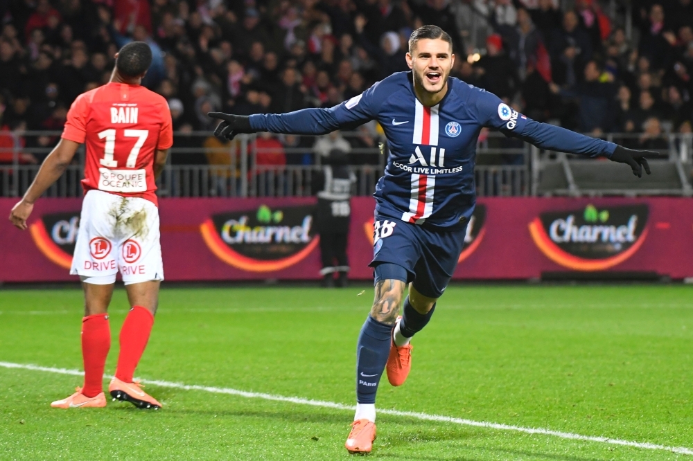Paris Saint-Germain's Argentine forward Mauro Icardi (R) vies with Brest's players before scoring a goal during the French L1 football match between Stade Brestois 29 and Paris Saint-Germain in Brest, western France on Saturday. — AFP
