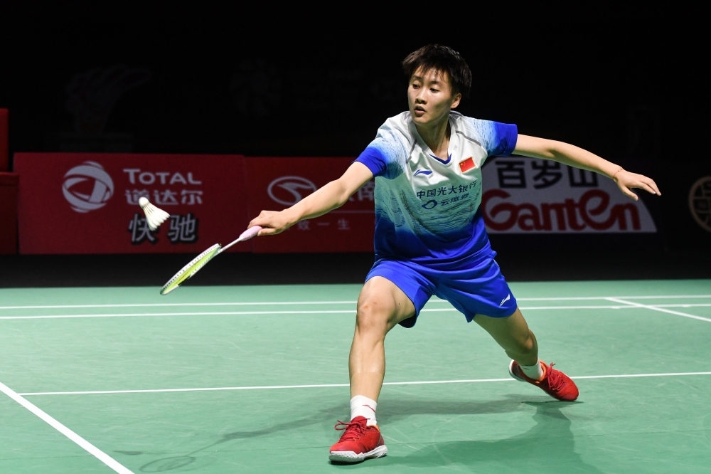 Kento Momota of Japan hits a return against Chou Tien-chen of Taiwan during their men's singles final match at the Fuzhou China Open badminton tournament in Fuzhou in China's eastern Fujian province on Sunday. — Reuters