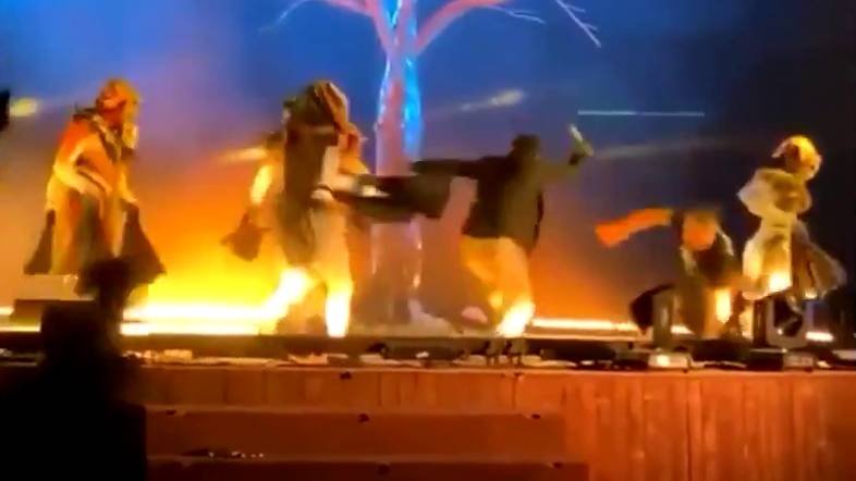 The man was seen stomping onto the stage to attack performers in theatrical costumes during a musical performance. (Supplied)
