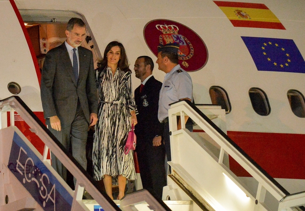Spanish King Felipe VI (L) and Queen Letizia arrive at Havana's Jose Marti International Airport on Monday. -AFP