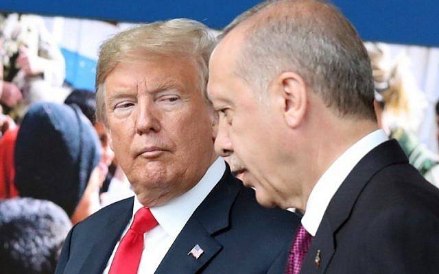 US President Donald Trump, left, talks to Turkey's President Recep Tayyip Erdogan as they arrive for the NATO summit at the NATO headquarters in Brussels in this July 11, 2018 file photo. — AFP