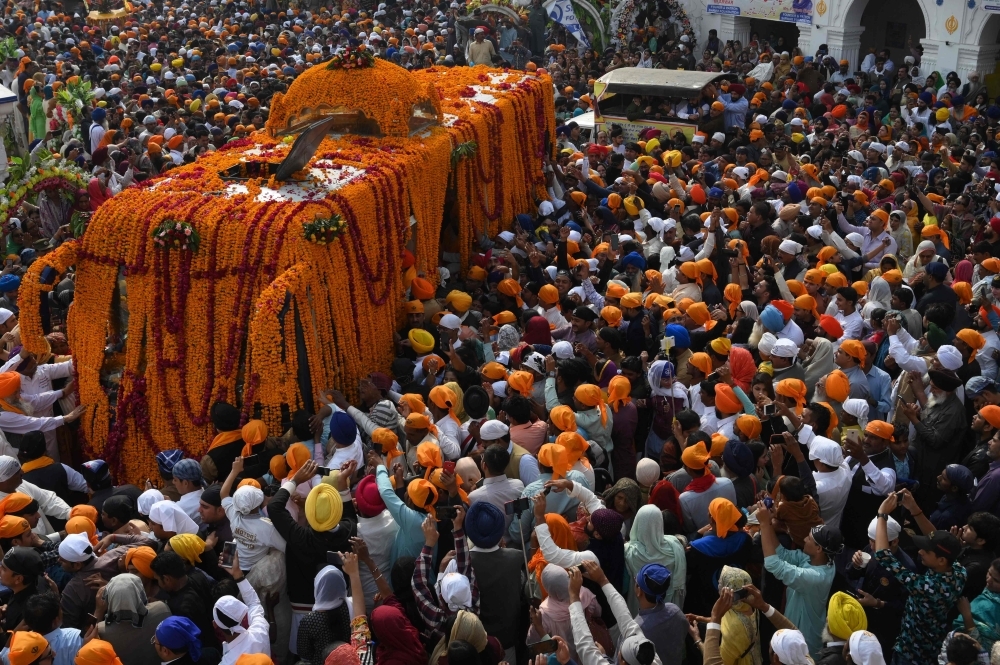 India's President Ram Nath Kovind, center, pays obeisance at Gurudwara Ber Sahib in Sultanpur Lodhi in north Indian state of Punjab on Tuesday. — AFP