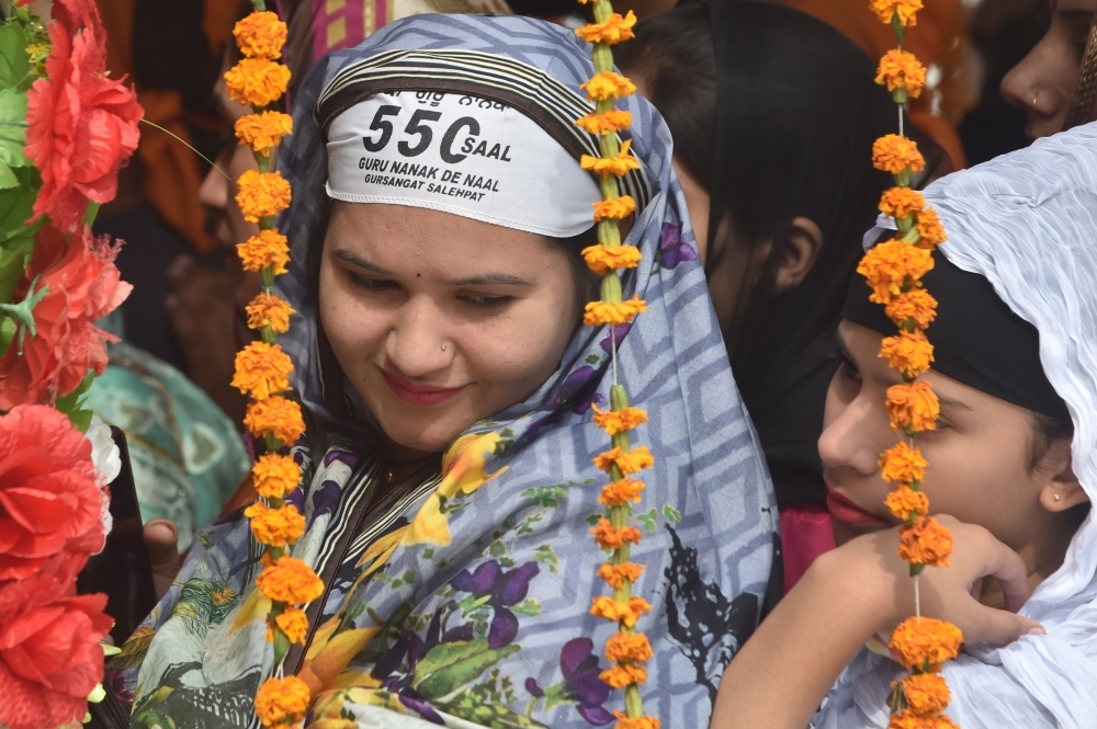 India's President Ram Nath Kovind, center, pays obeisance at Gurudwara Ber Sahib in Sultanpur Lodhi in north Indian state of Punjab on Tuesday. — AFP