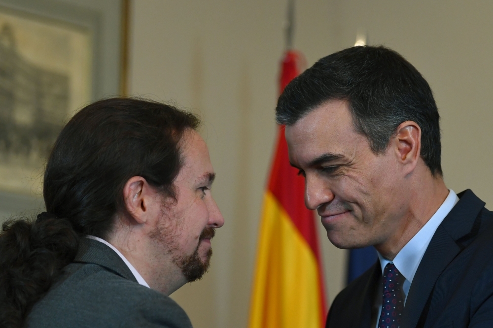 Spanish incumbent prime minister Pedro Sanchez, right, and the leader of the left-wing electoral alliance 