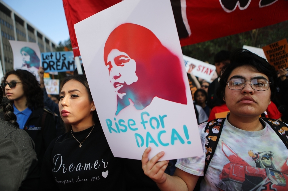 At left, Congressional Hispanic Caucus chairman Rep. Joaquin Castro (D-TX) looks on during a news conference to discuss the Supreme Court case involving Deferred Action for Childhood Arrivals (DACA) at the U.S. Capitol on Tuesday in Washington, DC. -AFP