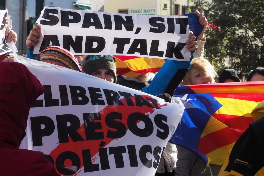 Protesters block a street during a demonstration called by the Catalan pro-independence left youth group 'Arran' on Tuesday in Barcelona, against the sentencing last month of nine of their leaders to lengthy jail terms. -AFP