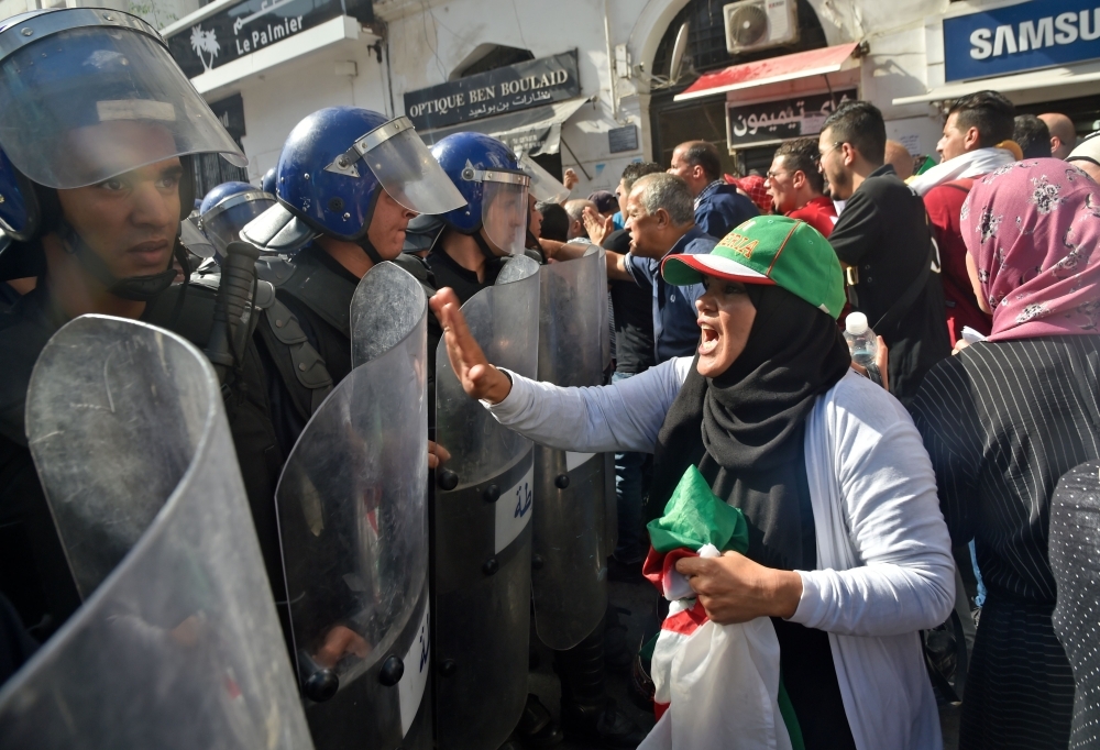 Algerian protesters chant anti-government slogans during a protest near the parliament building in Algiers in this Oct. 13, 2019 file photo. — AFP