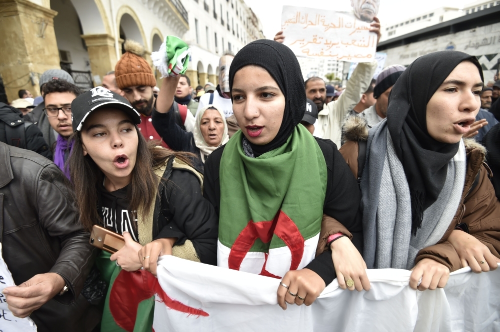 Algerian protesters chant anti-government slogans during a protest near the parliament building in Algiers in this Oct. 13, 2019 file photo. — AFP