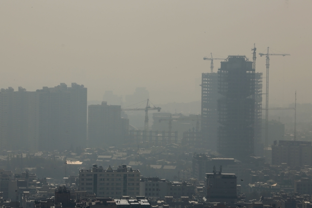 A general view taken from Western Tehran shows a blanket of brown-white smog covering the city as heavy pollution hit the Iranian capital on Wednesday. — AFP