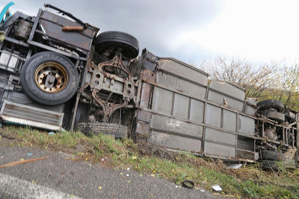 The emergency services work at the scene of collision between a public bus and a truck near the village of Malanta on the outskirts of the city of Nitra, western Slovakia, on Wednesday. — AFP