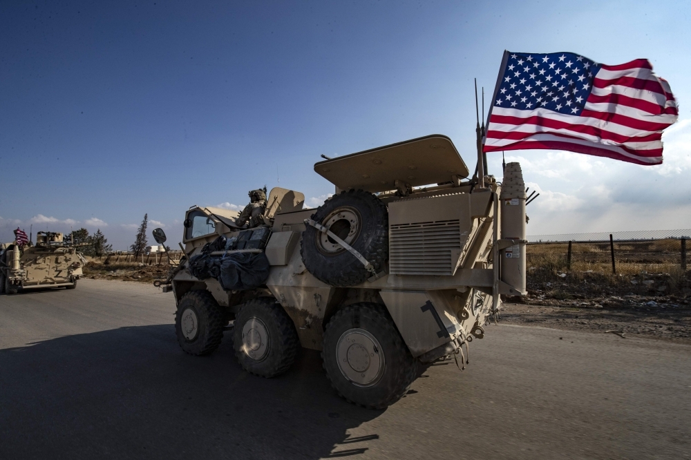 A convoy of US troops is pictured outside the Kurdish-majority city of Qamishli, in Syria's northeastern Hasakeh province, in this Nov. 02, 2019 file photo. — AFP