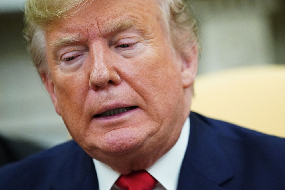 US President Donald Trump is seen in the Oval Office of the White House in Washington on Wednesday. — AFP