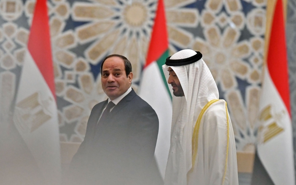 Egyptian President Abdel Fattah El-Sisi and the Crown Prince of Abu Dhabi, Sheikh Mohamed Bin Zayed Al-Nahyan, attend a welcome ceremony in the Emirati capital's Al-Watan presidential palace in Abu Dhabi on Thursday. — AFP