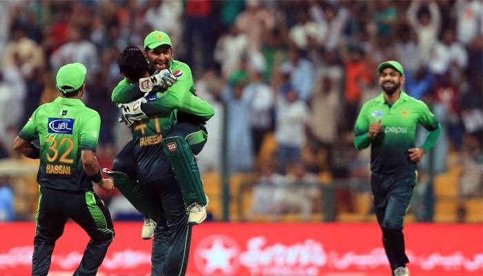 Pakistan's captain Sarfraz Ahmed celebrates with Faheem Ashraf during the second T20 cricket match between Sri Lanka and Pakistan at the Sheikh Zayed Stadium, Abu Dhabi, in this Oct. 27, 2017 file photo. — AFP
