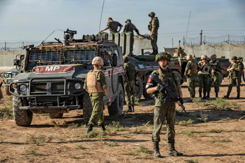 Russian military police take part in a joint Turkish-Russian army patrol near the town of Darbasiyah in Syria's northeastern Hasakeh province along the Syria-Turkey border in this Nov. 11, 2019 file photo. — AFP