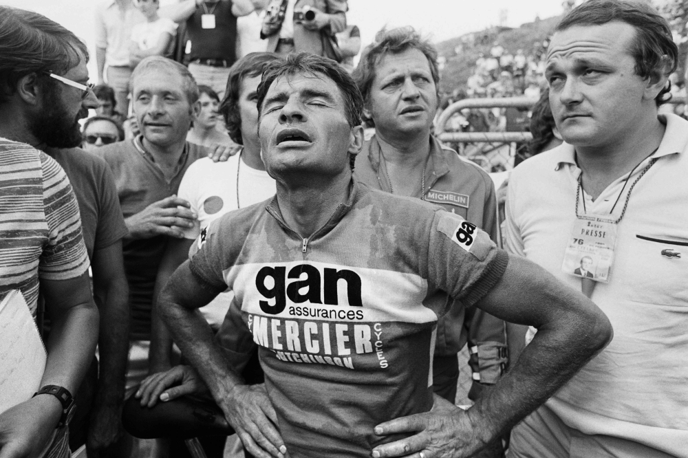 In this file photo taken on Sept. 5, 1978 former French Bicycle racer Raymond Poulidor (R) and François Gadot-Clet, French CEO of Manufrance, French Arms and Cycle Factory of St. Etienne, offer a bike to young girl Christine Donna, in Clermont Ferrand. Poulidor died on Nov. 13, 2019 aged 83, his family announced. — AFP 