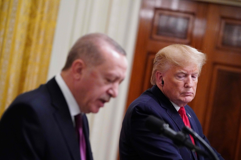 US President Donald Trump and Turkey's President Recep Tayyip Erdogan, left, take part in a joint press conference in the East Room of the White House in Washington on Wednesday. — AFP