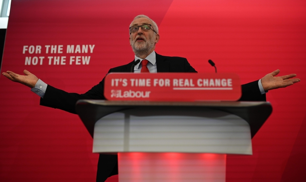 Britain's opposition Labour party leader Jeremy Corbyn talks with students at Lancaster University regarding the party's plans to deliver fast and free full fiber broadband across the country if they win the General Election on Friday. — AFP