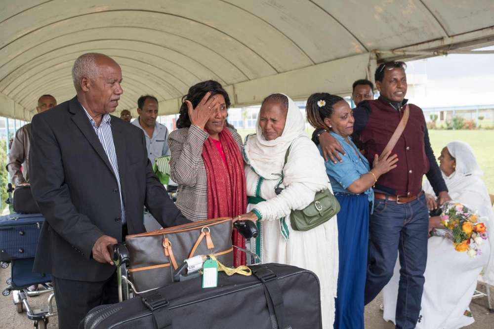 Azmera Addisalem, second left, and her family get emotional after meeting her father (who is an Ethiopian journalist) for the first time in twenty years, upon his arrival at the Asmara International airport in this July 18, 2018 file photo. — AFP