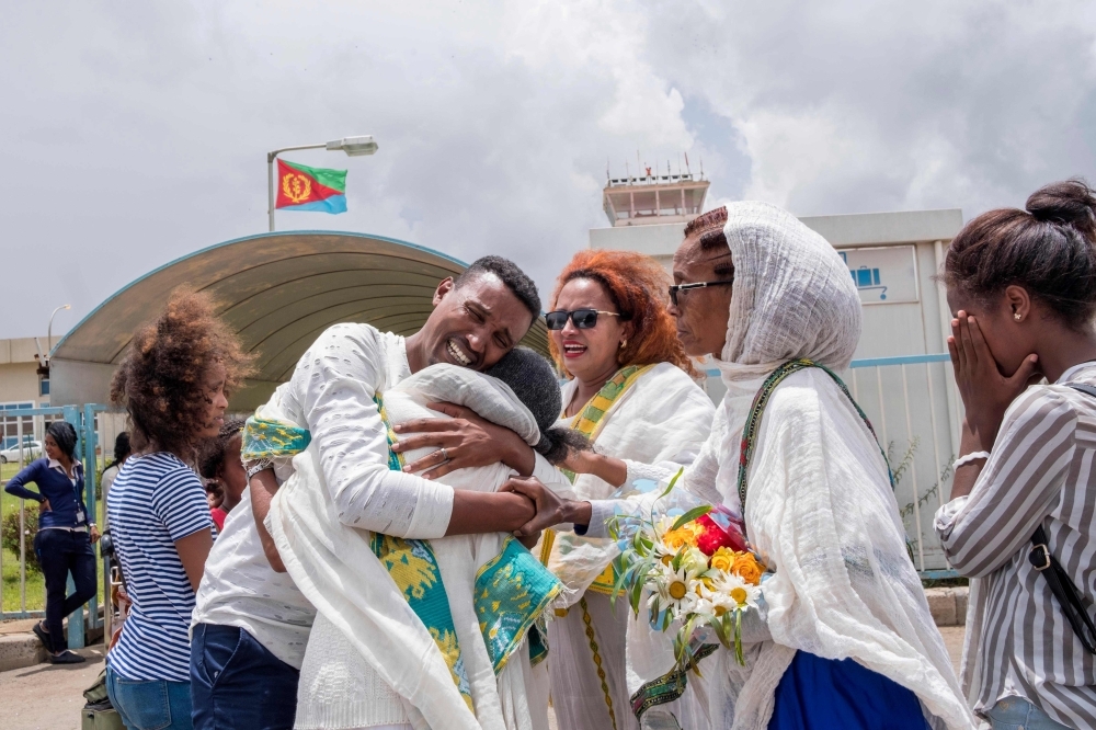 Azmera Addisalem, second left, and her family get emotional after meeting her father (who is an Ethiopian journalist) for the first time in twenty years, upon his arrival at the Asmara International airport in this July 18, 2018 file photo. — AFP