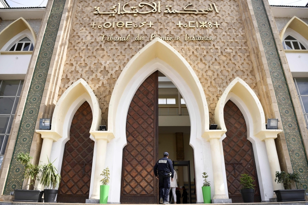 A member of the Moroccan security forces stands in front of the tribunal of Sale near the capital Rabat on Thursday during the trial of Mohamed Mounir, a Moroccan rapper,  widely known as 'Simo Gnawi', arrested in the beginning of this month for insulting the Moroccan police. — AFP