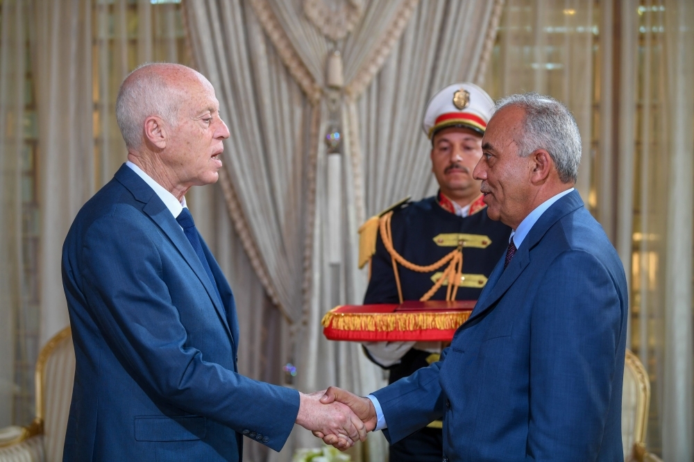 Tunisia's President Kais Saied, right, receives Ennahdha leader and parliament speaker Rached Ghannouchi at the presidential palace in the capital's eastern suburb of Carthage on Friday. — AFP