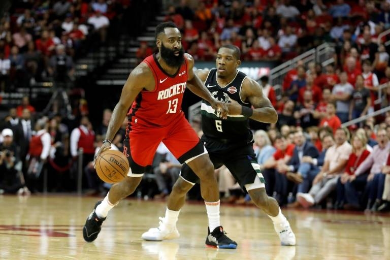 Houston Rockets' James Harden (13) drives toward the basket as Indiana Pacers' Justin Holiday (8) defends during the second half of an NBA basketball game in Houston, on Friday. The Rockets won 111-102. — Courtesy photo