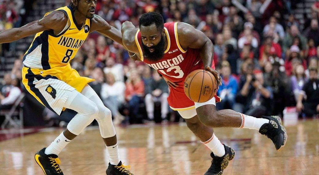 Houston Rockets' James Harden (13) drives toward the basket as Indiana Pacers' Justin Holiday (8) defends during the second half of an NBA basketball game in Houston, on Friday. The Rockets won 111-102. — Courtesy photo