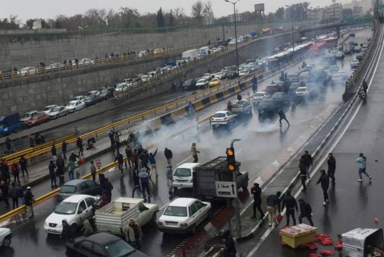 People protesting against increased petrol prices on a highway in Tehran on Saturday. -Courtesy photo
