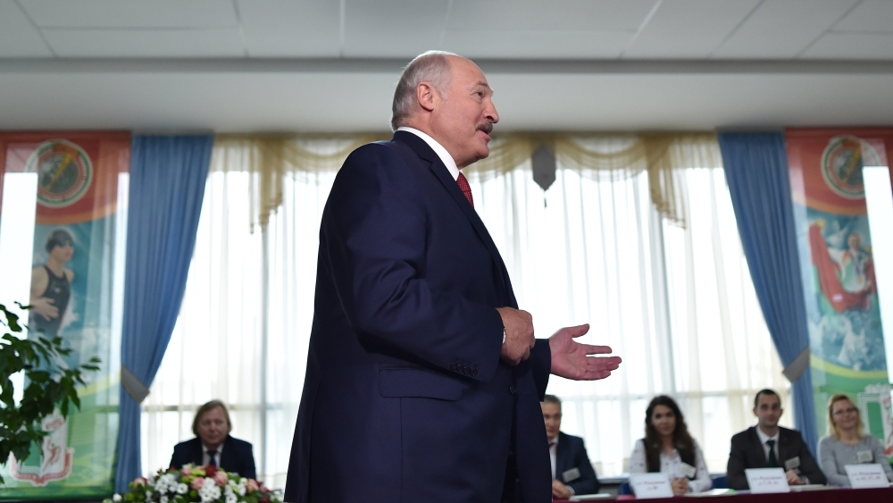 Belarus' President Alexander Lukashenko votes at a polling station during Belarus' parliamentary election in Minsk on Sunday. — AFP