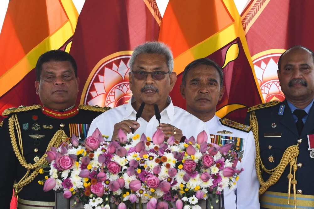 Sri Lanka's President Gotabaya Rajapaksa (C) speaks during his swearing-in ceremony at the Ruwanwelisaya temple in Anuradhapura on Monday. -AFP