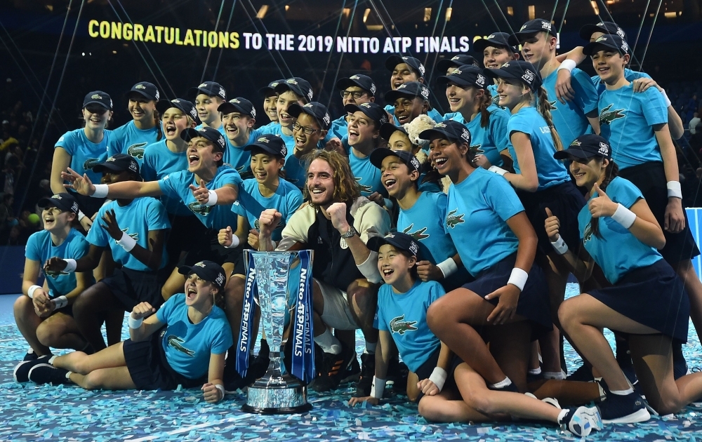 Greece's Stefanos Tsitsipas poses with the winner's trophy after winning the men's singles final match on day eight of the ATP World Tour Finals tennis tournament at the O2 Arena in London on Sunday. Tsitsipas beat Austria's Dominic Thiem to win the match 6-7, 6-2, 7-6. — AFP