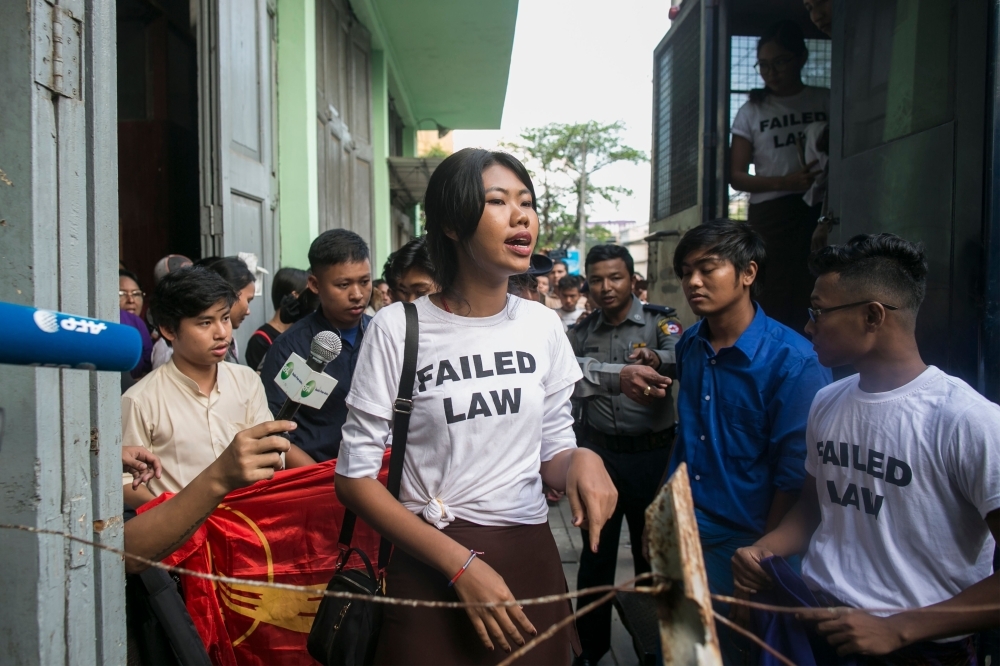 Kay Khaing Tun, a performer of Peacock Generation group, speaks to journalists peak after a trial in Yangon on Monday. — AFP