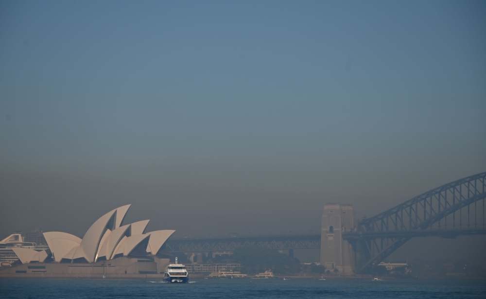 Smoke from bushfires blanket Sydney on Tuesday. -AFP