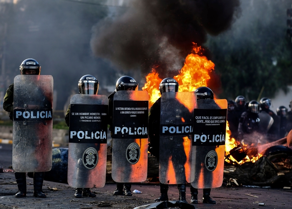 Supporters of Bolivian ex-President Evo Morales shout slogans during a demonstration in Cochabamba, on Monday. -AFP