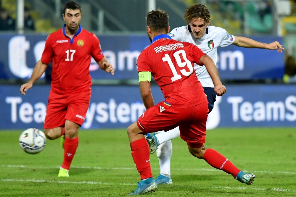 Italy's forward Ciro Immobile (C) shoots on goal during the Euro 2020 1st round Group J qualifying football match Italy v Armenia at the Renzo-Barbera stadium in Palermo on Monday. — AFP