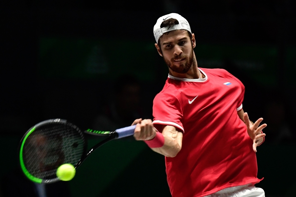 Russia's Karen Khachanov returns the ball to Croatia's Borna Coric during the singles tennis match between Croatia and Russia at the Davis Cup Madrid Finals 2019 in Madrid on Monday. — AFP