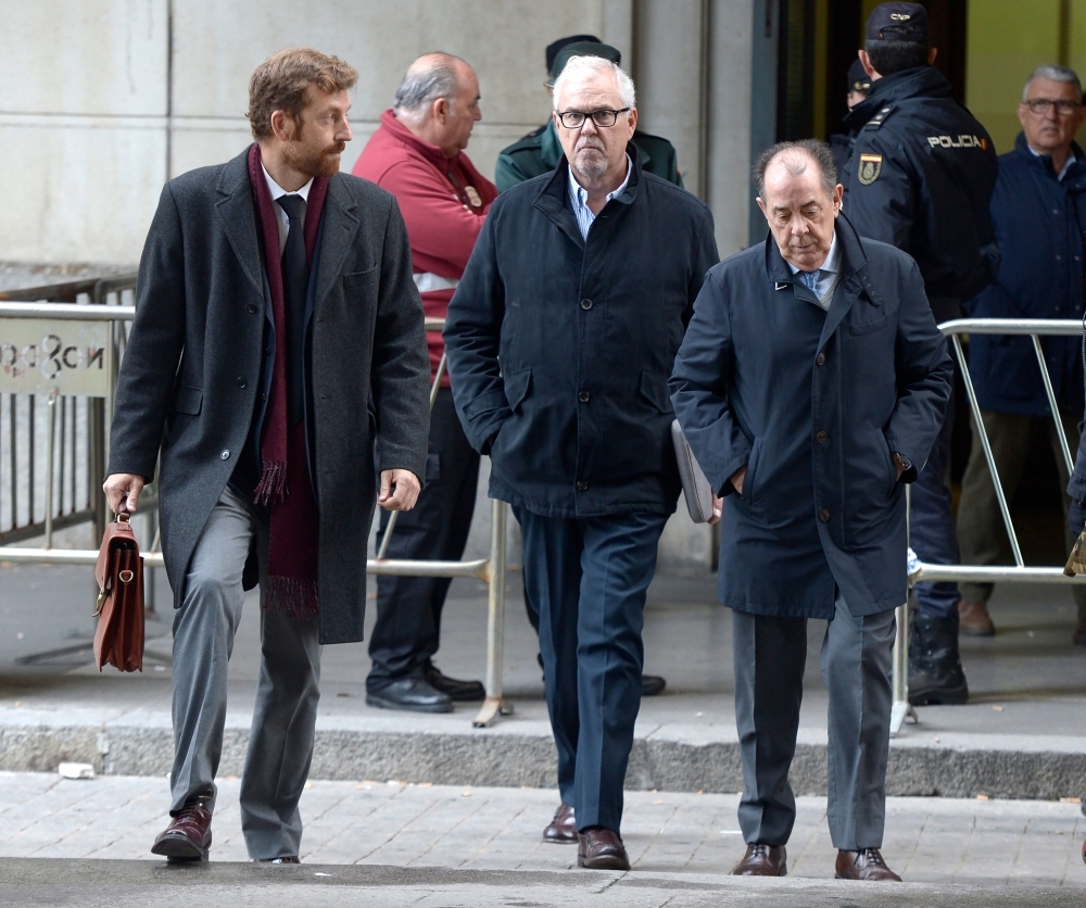 Former General Controller of the board of Andalusia Manuel Gomez Martinez, center,  arrives at the courthouse in Seville, Spain, on Tuesday. — AFP