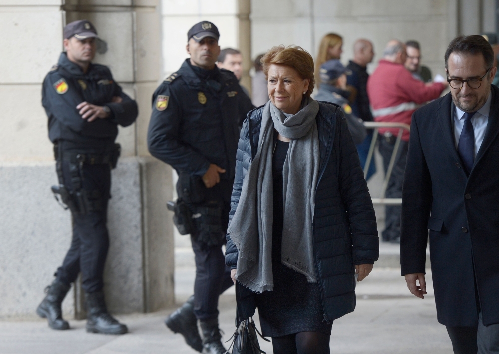 Former General Controller of the board of Andalusia Manuel Gomez Martinez, center,  arrives at the courthouse in Seville, Spain, on Tuesday. — AFP