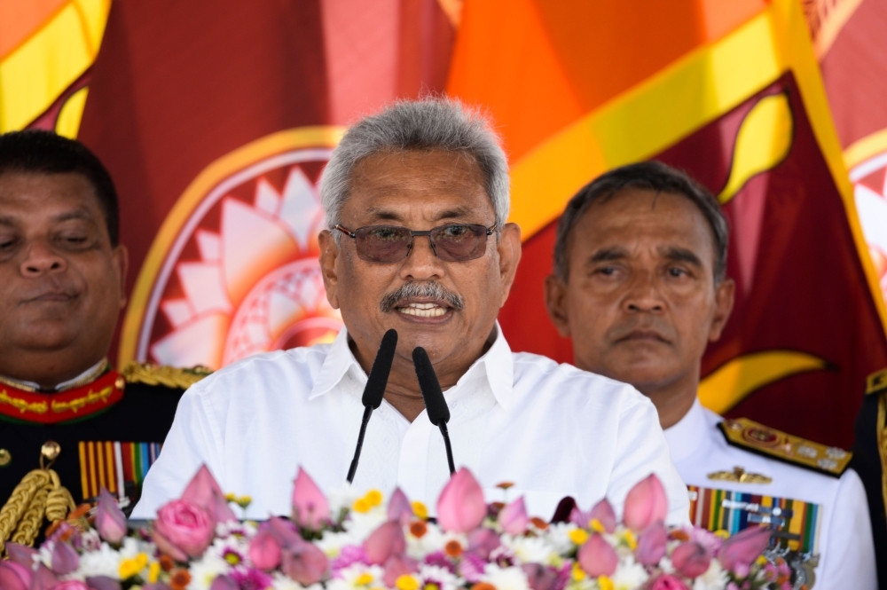 Sri Lanka's new President Gotabaya Rajapaksa, center, speaks after taking oath of office during his swearing-in ceremony at the Ruwanwelisaya temple in Anuradhapura on Monday. — AFP